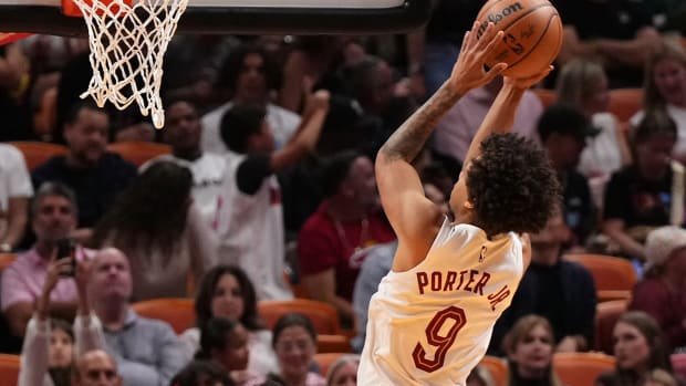 Dec 8, 2023; Miami, Florida, USA; Cleveland Cavaliers guard Craig Porter (9) shoots over Miami Heat guard Kyle Lowry (7) during the first half at Kaseya Center.
